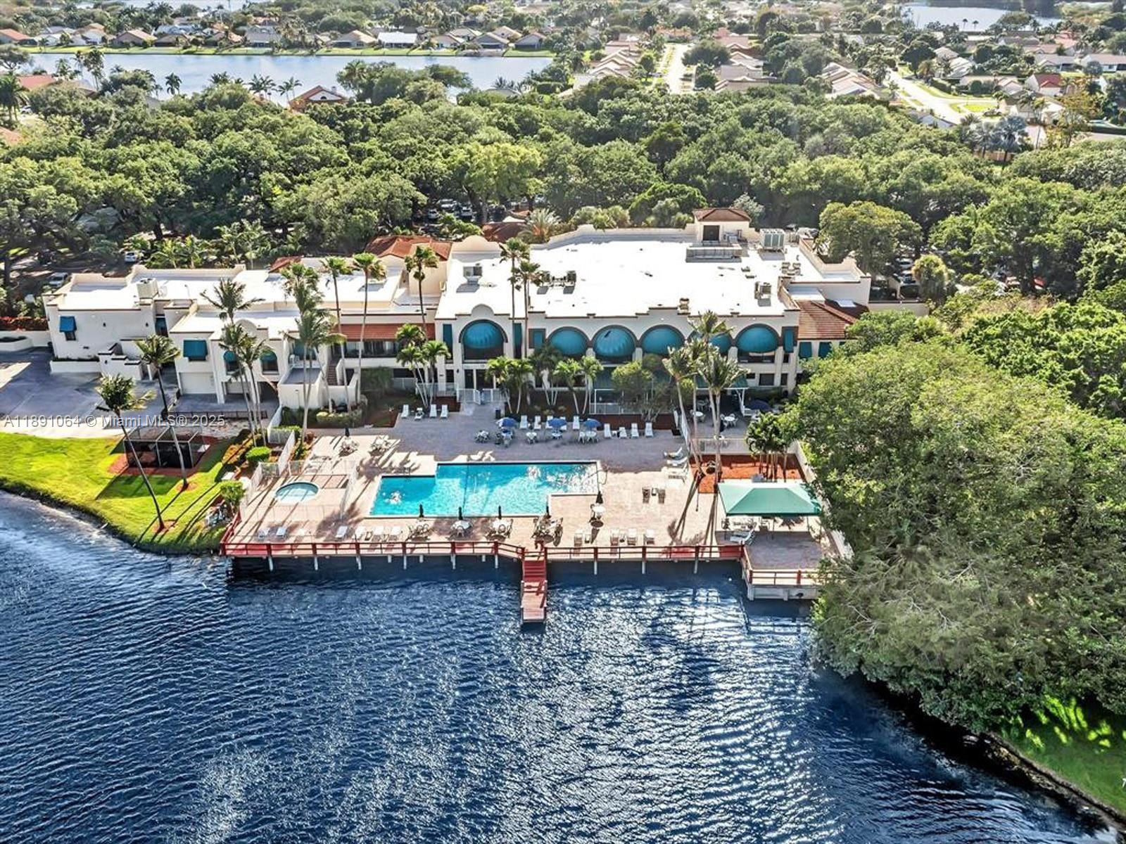 9430 Live Oak Place, Unit 404 Davie, FL 33324 - Photo 19 of 28 an aerial view of a house with swimming pool and patio