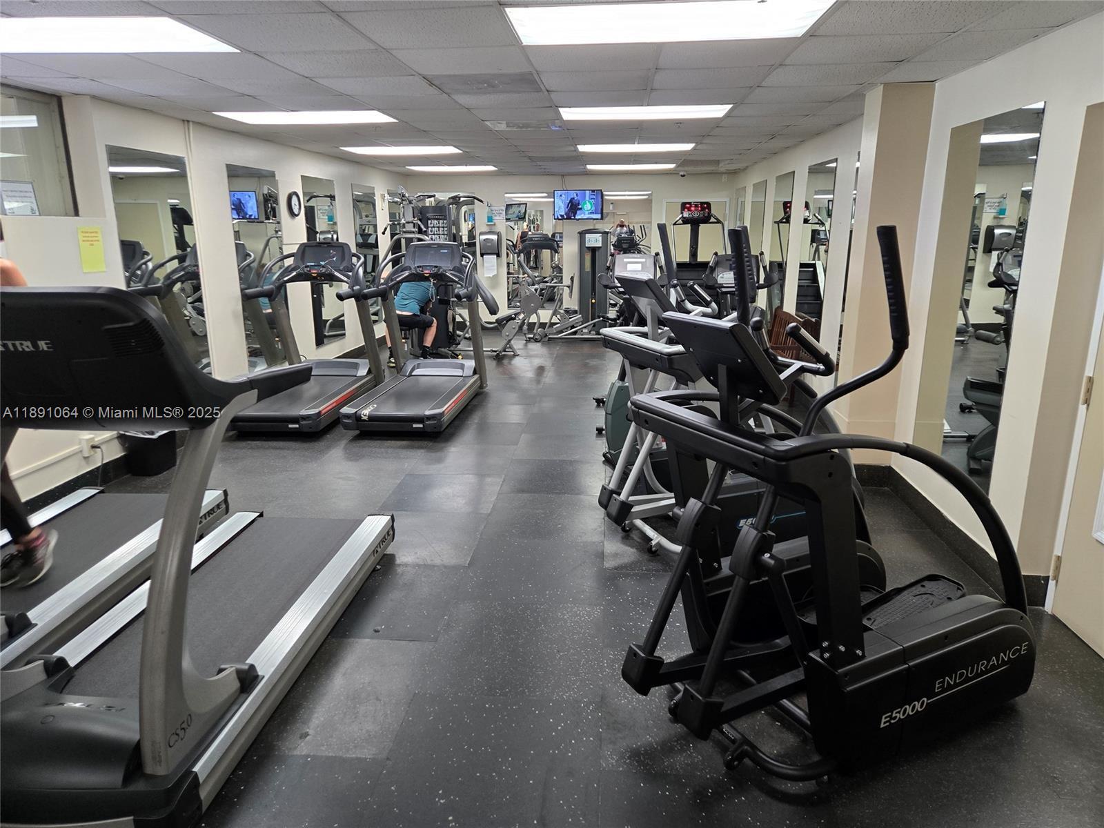 9430 Live Oak Place, Unit 404 Davie, FL 33324 - Photo 23 of 28 a view of a room with gym equipment