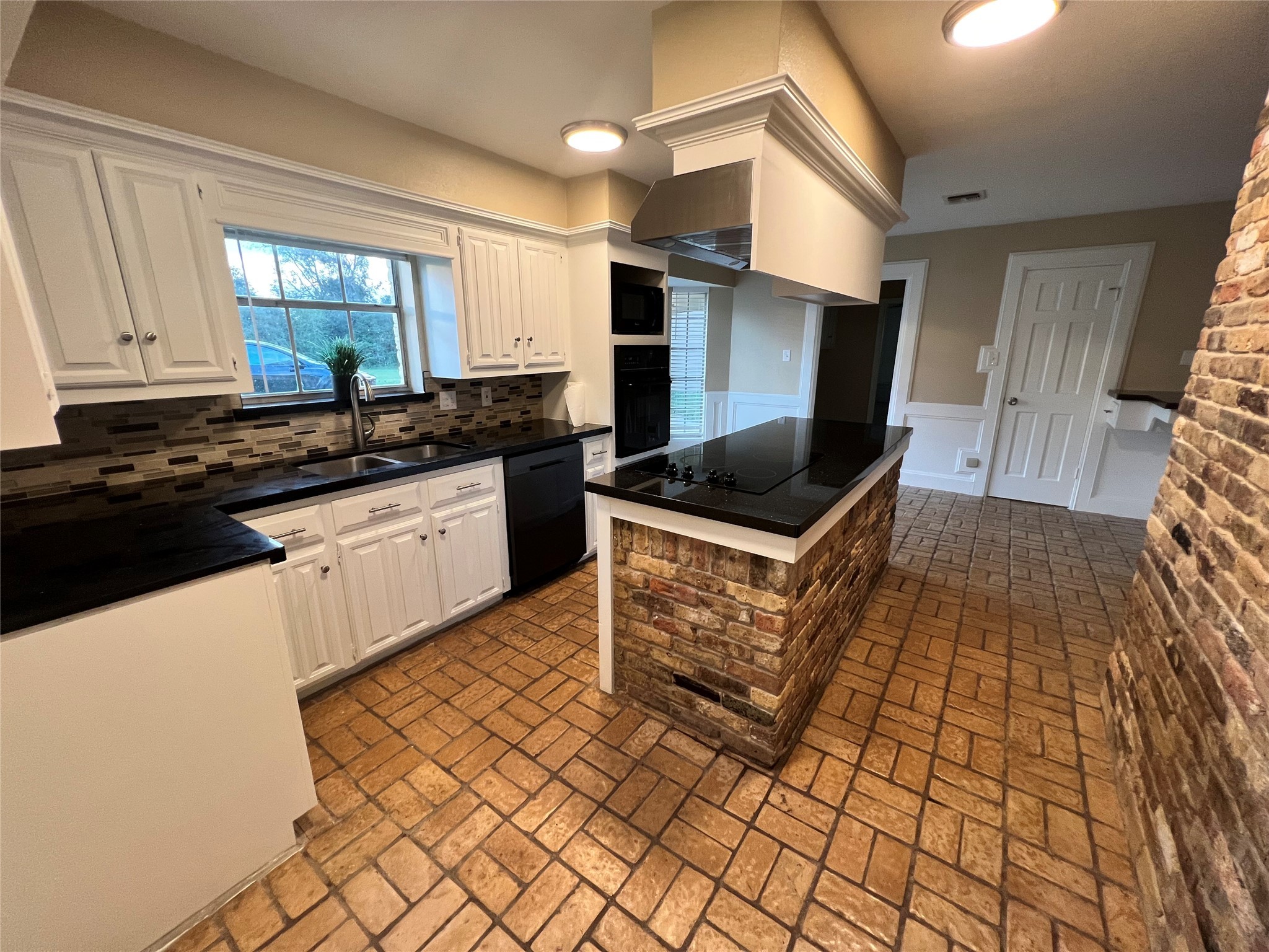 18240 Fenske Road Cypress, TX 77433 - Photo 4 of 20 a kitchen with stainless steel appliances granite countertop a sink and cabinets