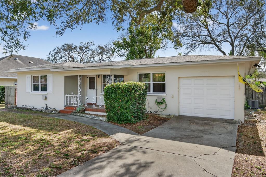 1739 Turner Street Clearwater, FL 33756 - Photo 1 of 72 a front view of a house with a yard and garage