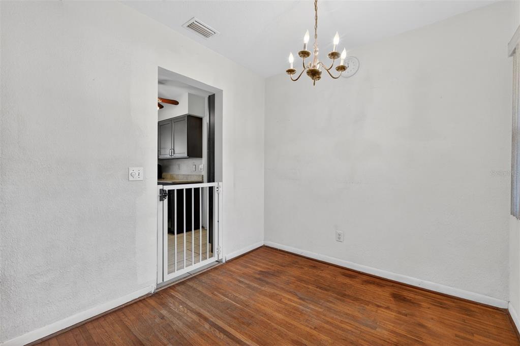 1739 Turner Street Clearwater, FL 33756 - Photo 17 of 72 a view of a room with wooden floor chandelier and windows
