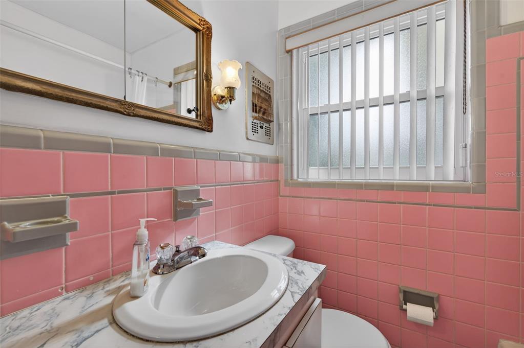 1739 Turner Street Clearwater, FL 33756 - Photo 31 of 72 a bathroom with a toilet a sink and mirror