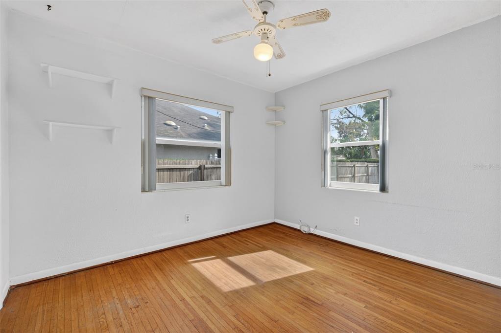1739 Turner Street Clearwater, FL 33756 - Photo 34 of 72 a view of empty room with wooden floor and fan