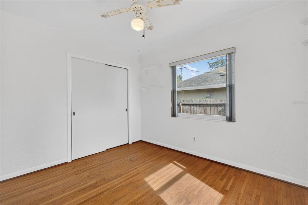 1739 Turner Street Clearwater, FL 33756 - Photo 37 of 72 an empty room with wooden floor and windows