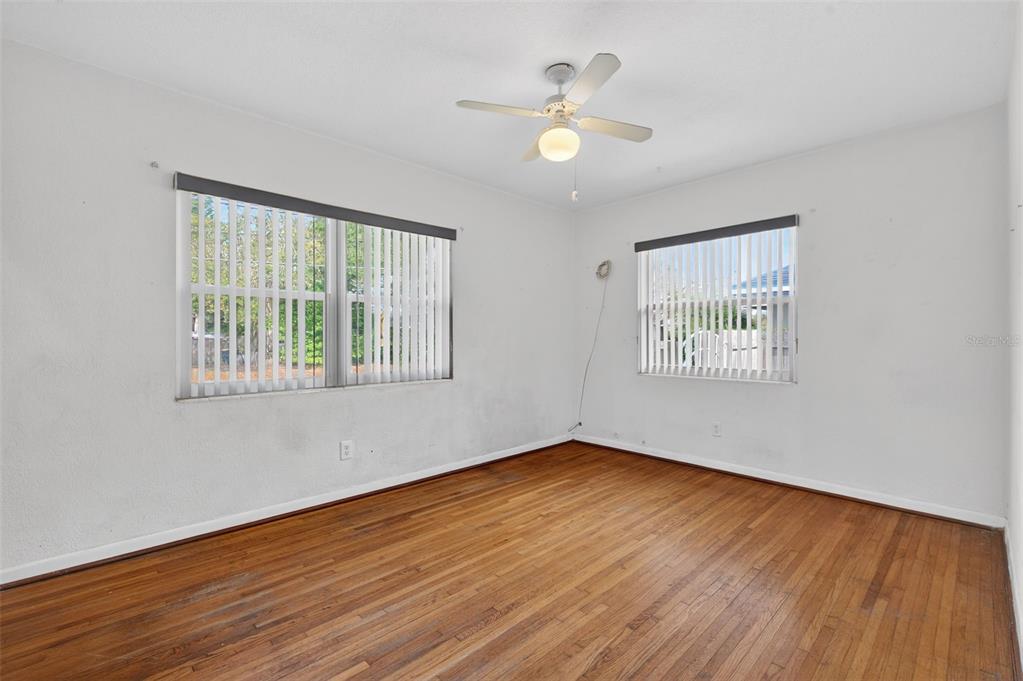 1739 Turner Street Clearwater, FL 33756 - Photo 38 of 72 a view of an empty room with wooden floor and a window