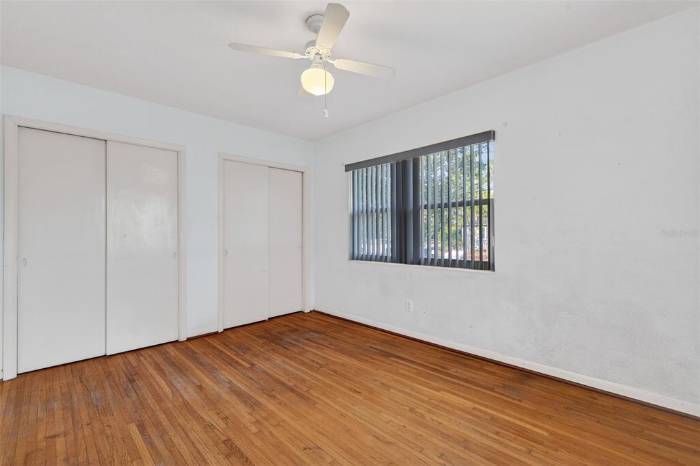 1739 Turner Street Clearwater, FL 33756 - Photo 41 of 72 an empty room with wooden floor fan and windows