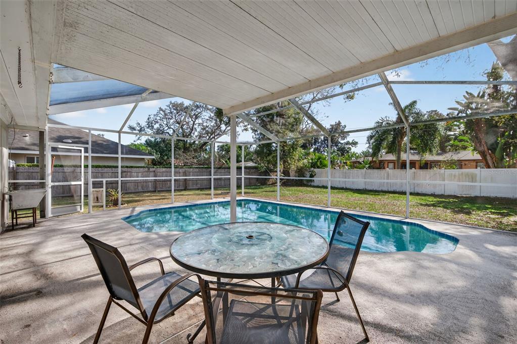 1739 Turner Street Clearwater, FL 33756 - Photo 45 of 72 a view of a swimming pool with a lounge chairs