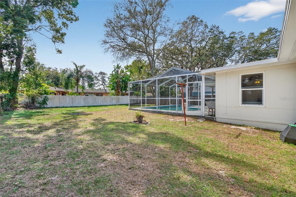 1739 Turner Street Clearwater, FL 33756 - Photo 49 of 72 a view of a house with backyard and trees