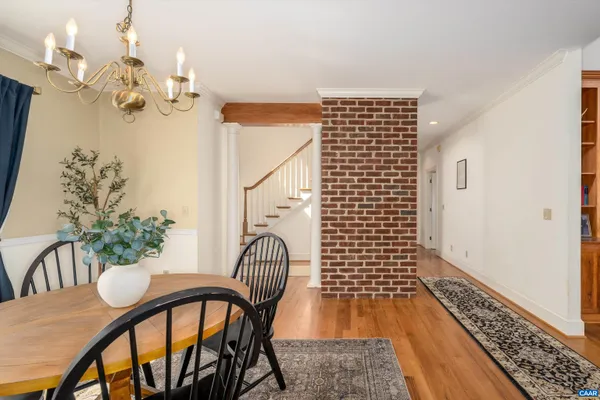 a living room with furniture and view of kitchen