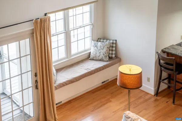 a living room with furniture fireplace and flat screen tv