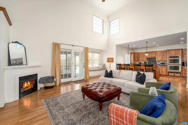 a living room with furniture fireplace and window