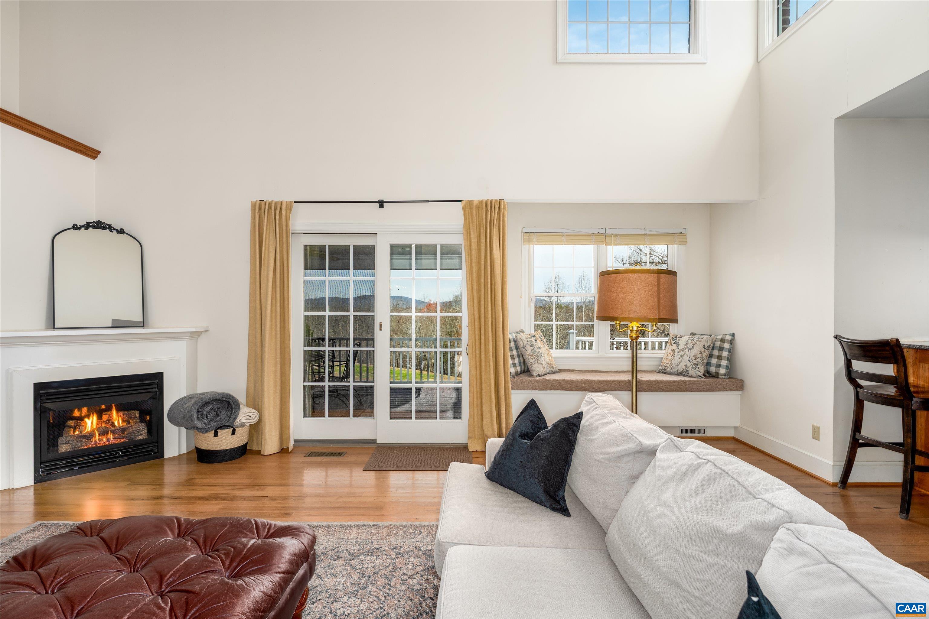 4444 Woods Edge Road Troy, VA 22974 - Photo 19 of 74 a living room with furniture fireplace and window