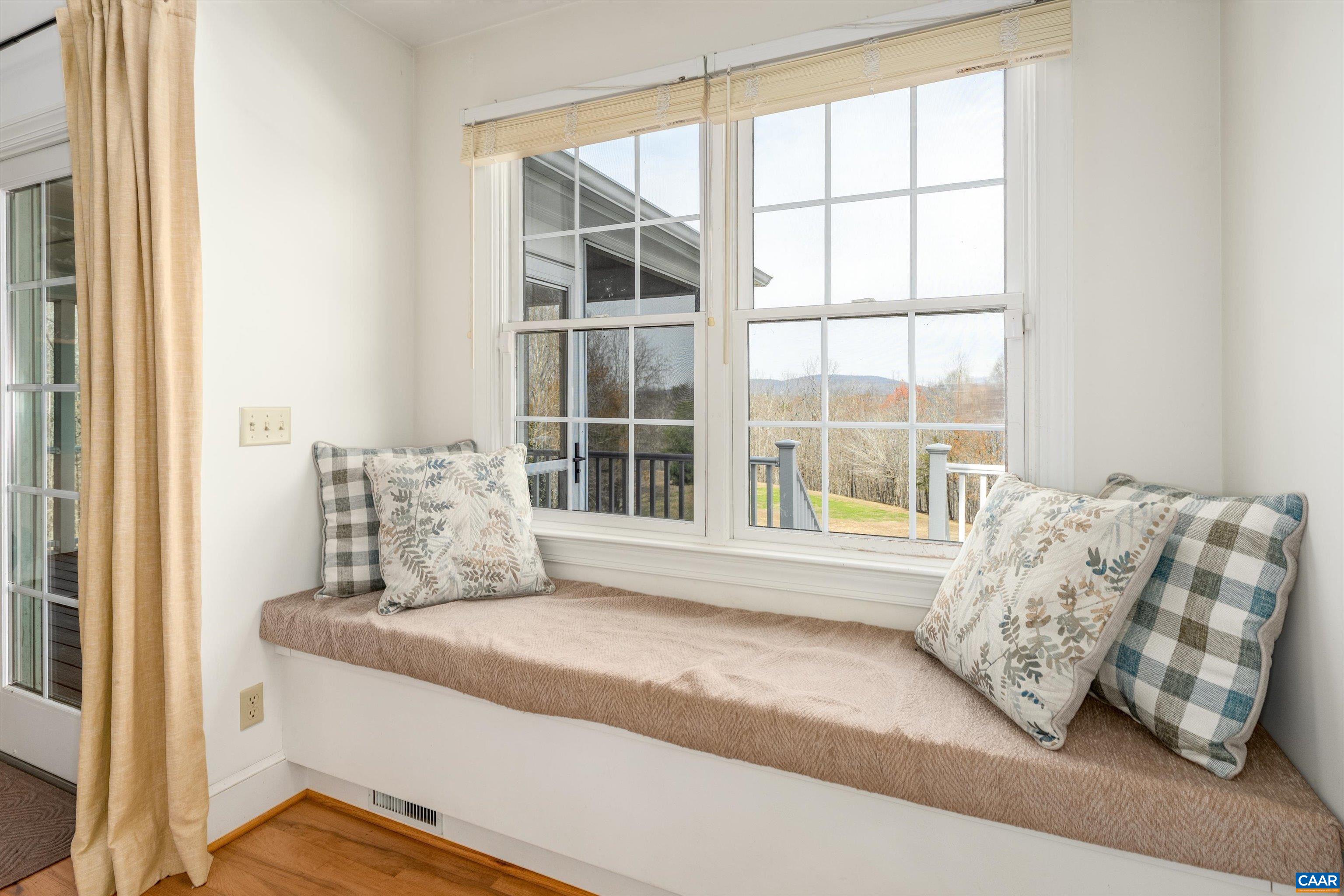 4444 Woods Edge Road Troy, VA 22974 - Photo 20 of 74 a bed sitting in a bedroom next to a window