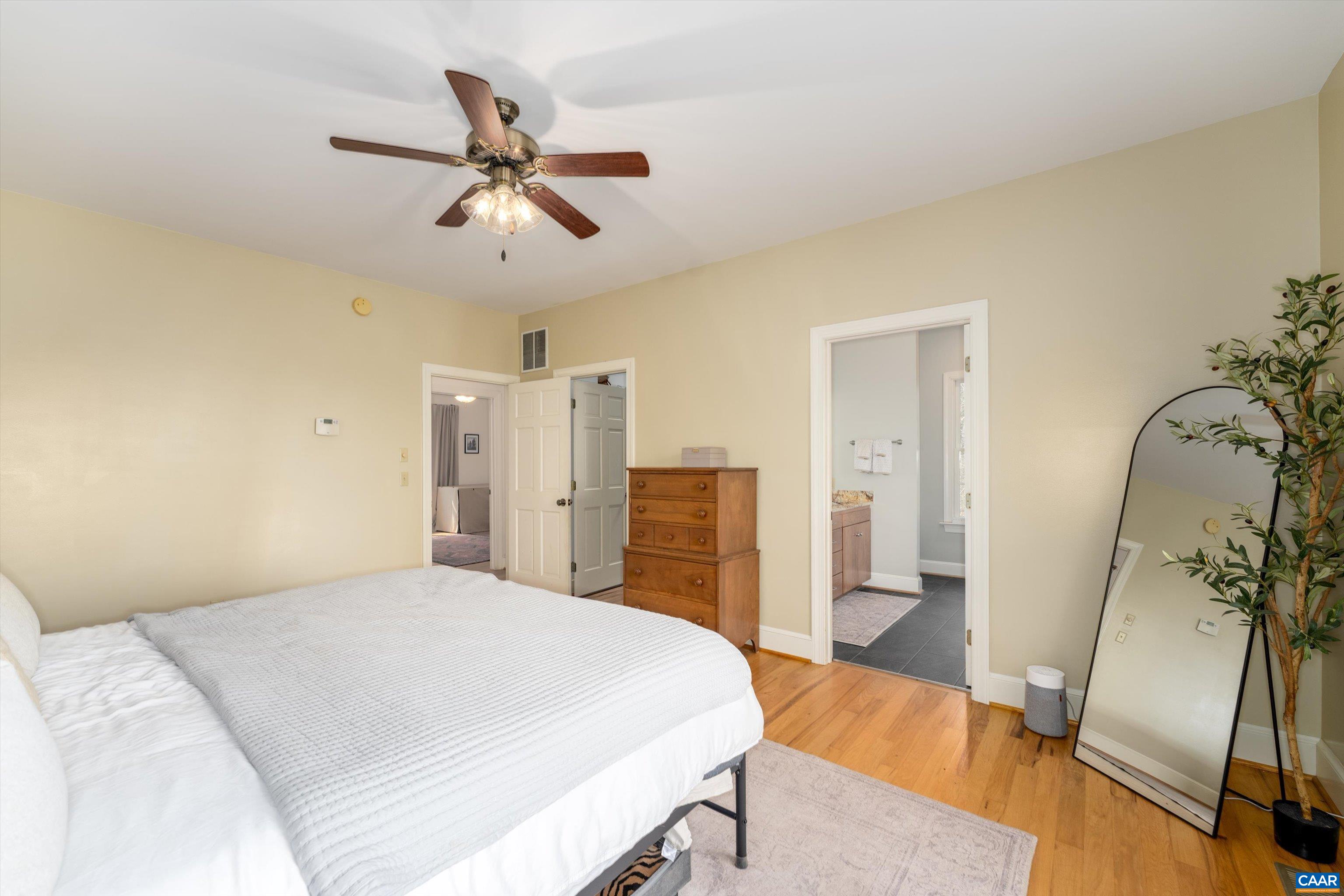 4444 Woods Edge Road Troy, VA 22974 - Photo 39 of 74 a bedroom with a bed and a chandelier