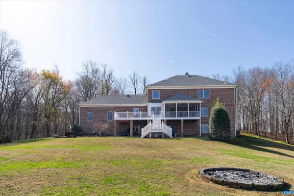 a front view of a house with a garden and yard