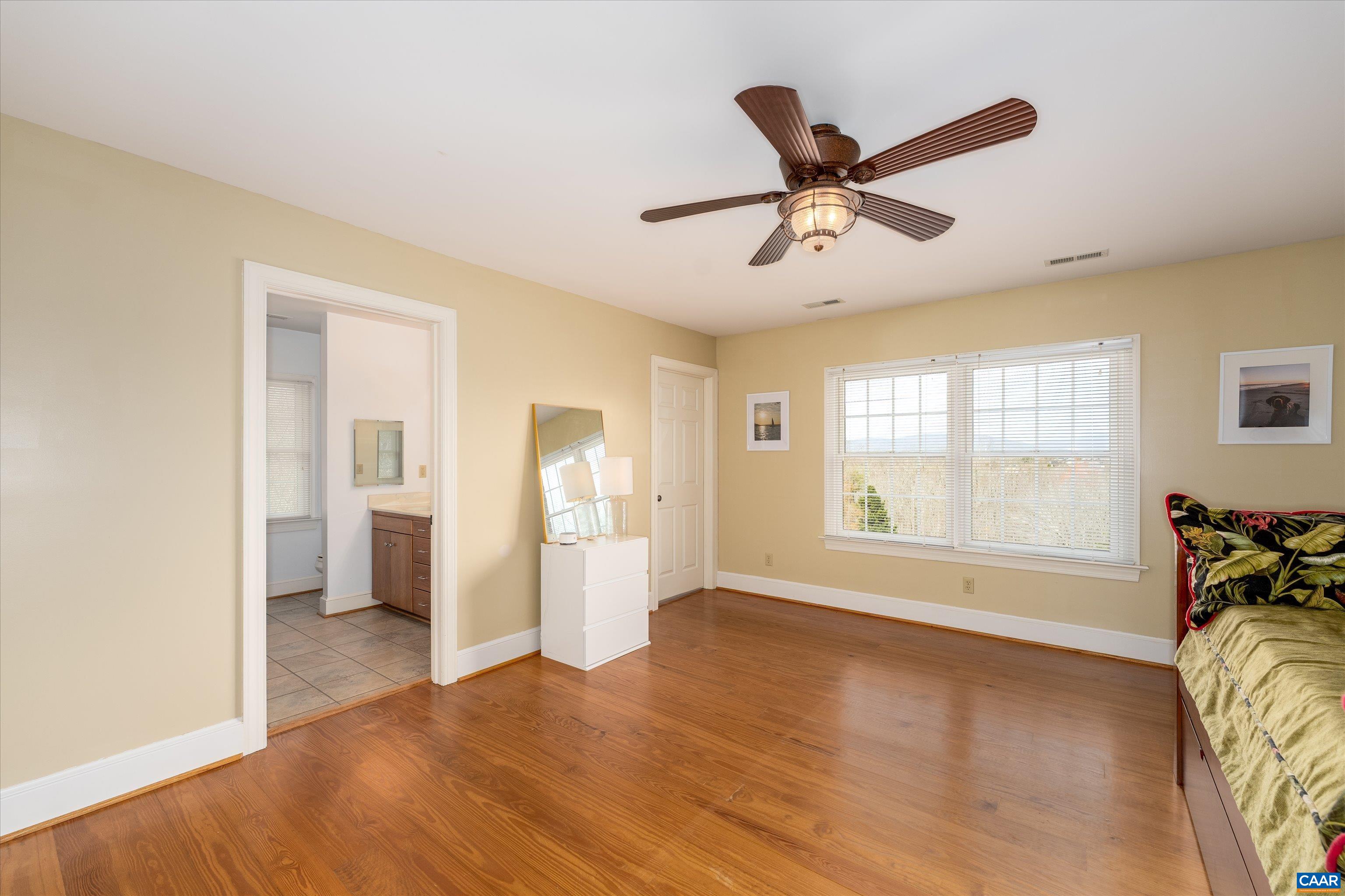 4444 Woods Edge Road Troy, VA 22974 - Photo 47 of 74 a view of a livingroom with a ceiling fan and window