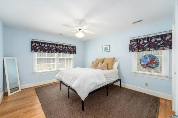 a view of a chairs and table in the balcony
