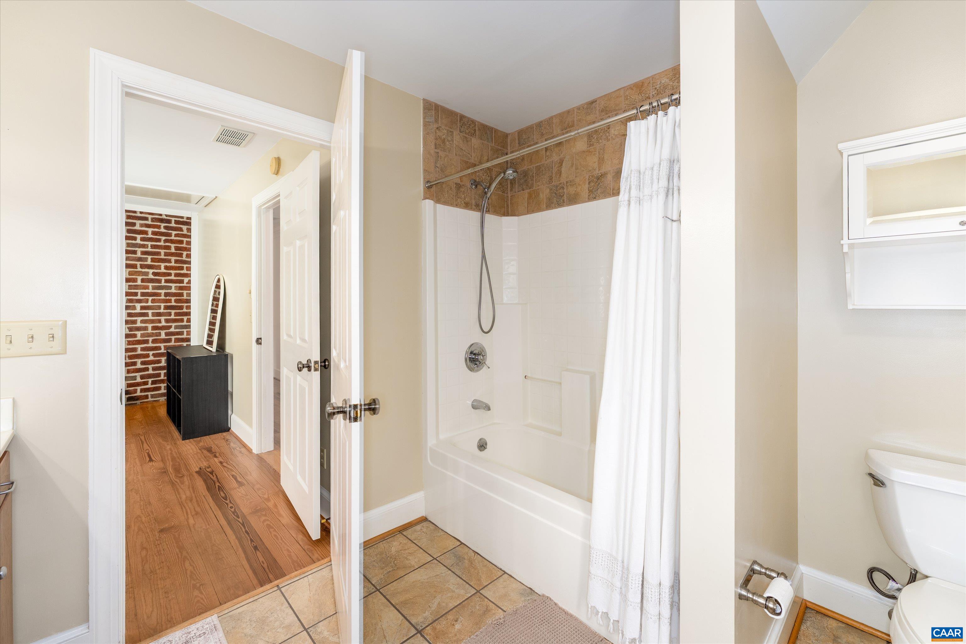 4444 Woods Edge Road Troy, VA 22974 - Photo 55 of 74 a bathroom with a shower and a glass door