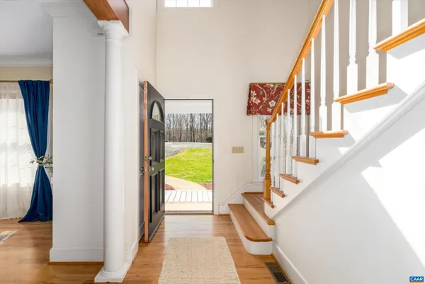 a view of a livingroom with furniture window and wooden floor