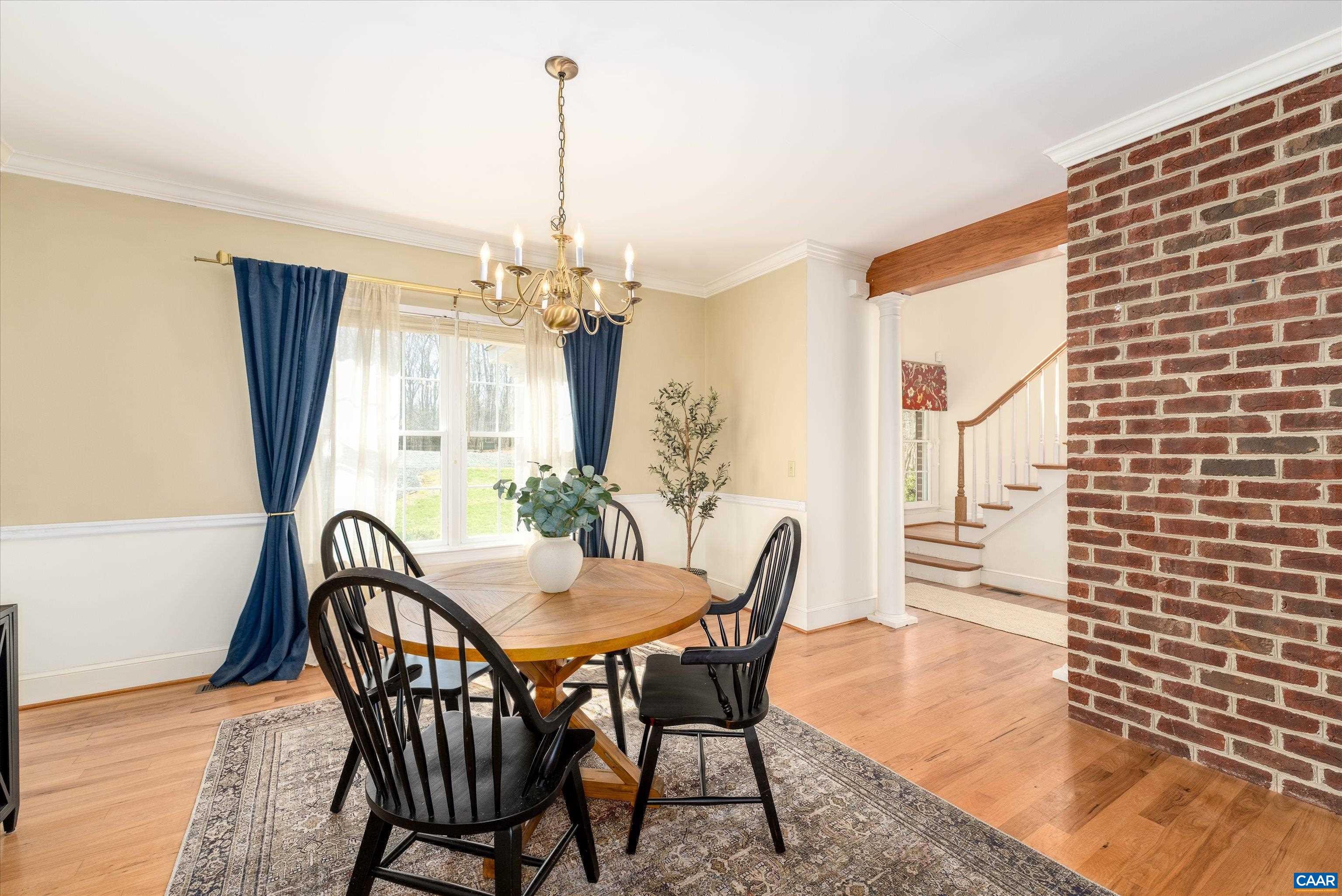 4444 Woods Edge Road Troy, VA 22974 - Photo 9 of 74 a view of a dining room with furniture window and wooden floor