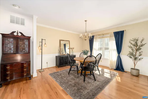 a living room with furniture fireplace and rug floor