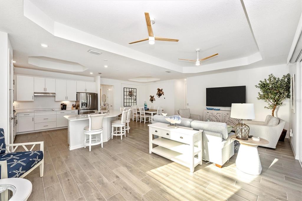 12950 Tulum Loop Venice, FL 34293 - Photo 19 of 98 a living room with furniture and a table