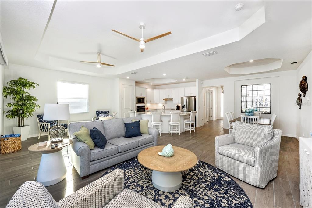 12950 Tulum Loop Venice, FL 34293 - Photo 23 of 98 a living room with furniture and a large window