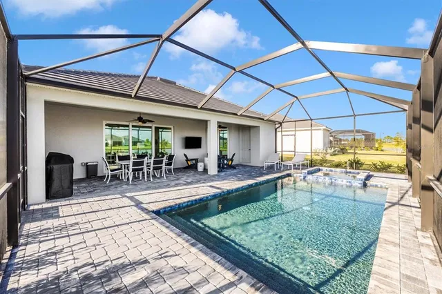 a building outdoor space with patio furniture and potted plants