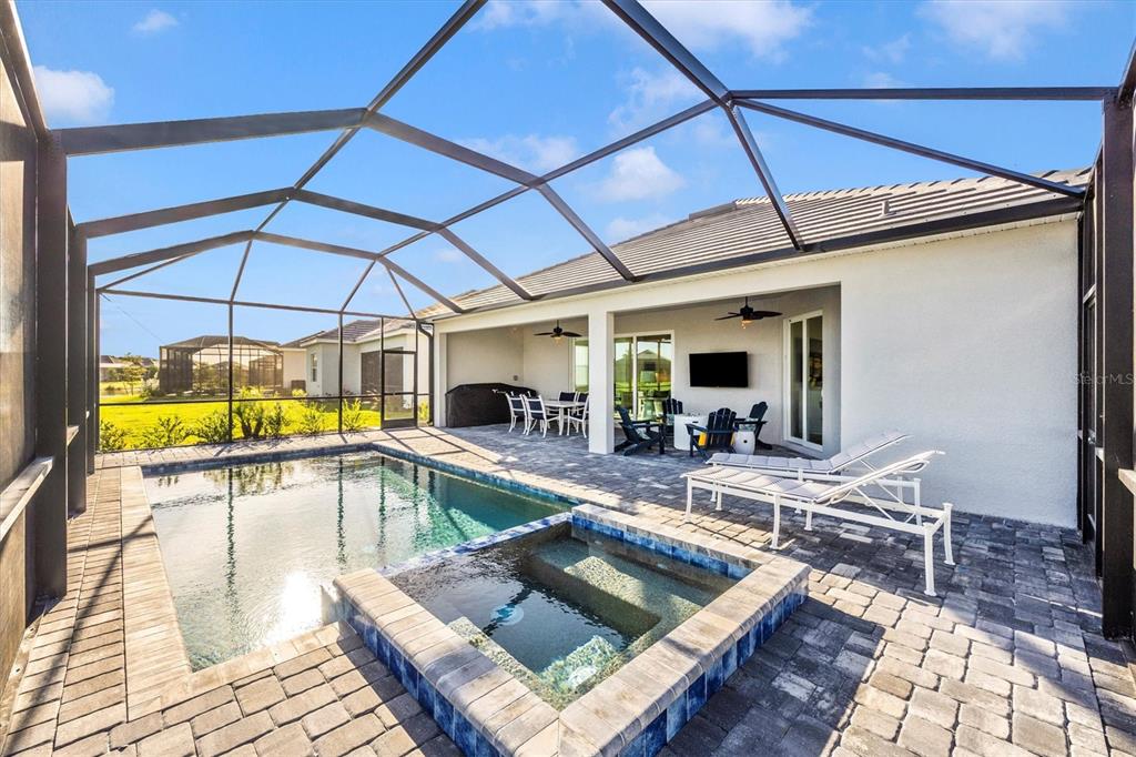 12950 Tulum Loop Venice, FL 34293 - Photo 43 of 98 a view of a swimming pool with a patio