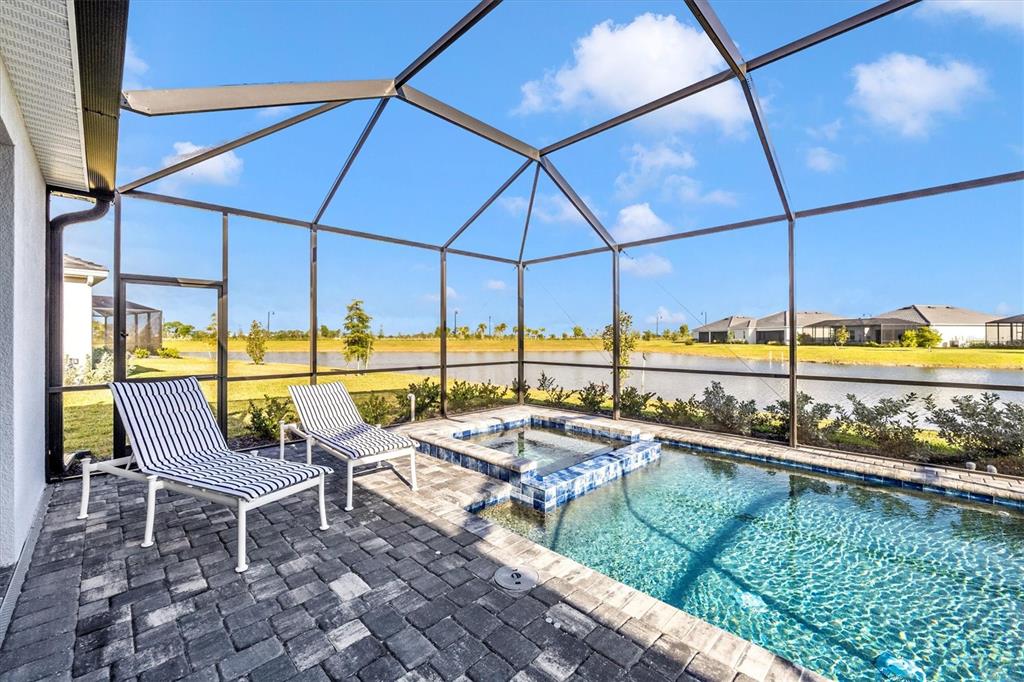 12950 Tulum Loop Venice, FL 34293 - Photo 47 of 98 a view of a swimming pool with a lounge chairs