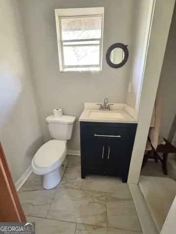 a bathroom with a sink and a toilet
