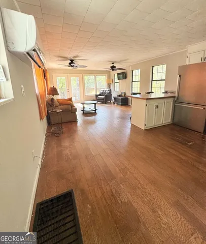 a view of a livingroom with furniture and a rug