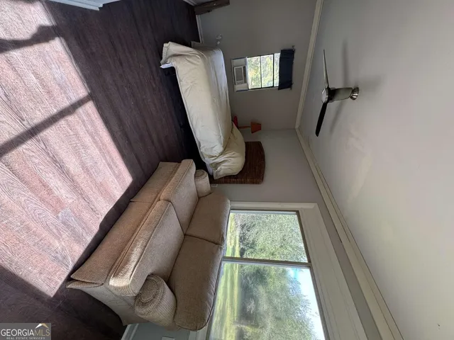 a view of hallway with furniture