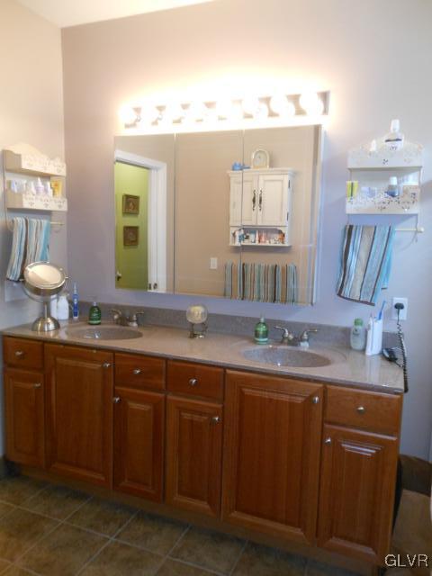 48 Inverness Lane Easton, PA 18045 - Photo 20 of 28 a bathroom with a granite countertop sink a large mirror and a window