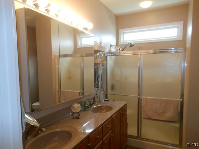 48 Inverness Lane Easton, PA 18045 - Photo 21 of 28 a bathroom with a sink and mirror