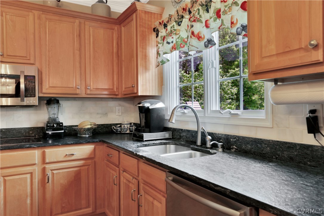 1201 Goswick Ridge Road Midlothian, VA 23114 - Photo 11 of 32 a kitchen with granite countertop a sink and a white wooden cabinets