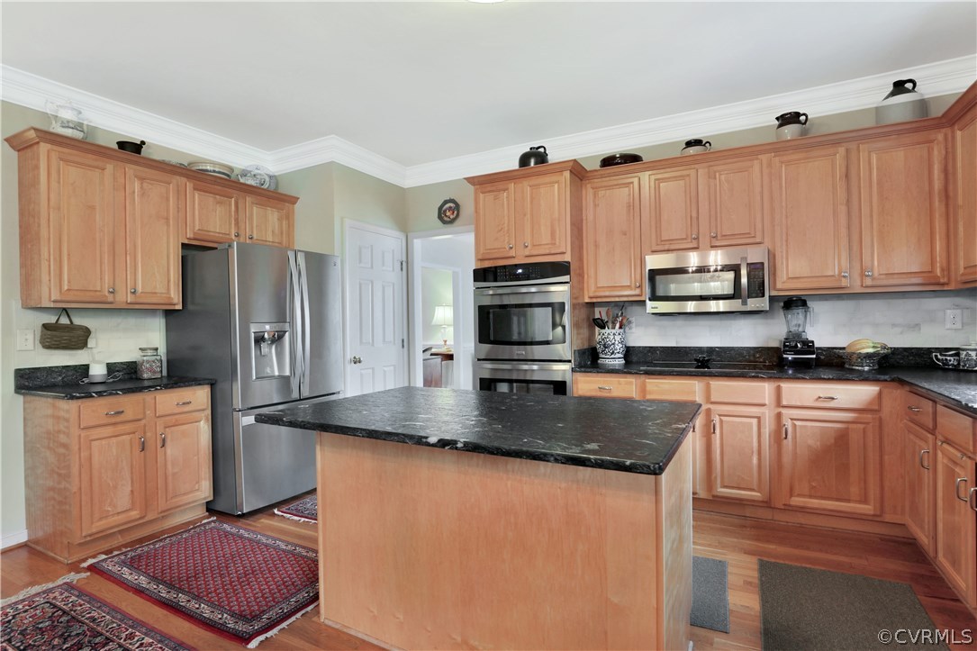 1201 Goswick Ridge Road Midlothian, VA 23114 - Photo 12 of 32 a kitchen with stainless steel appliances granite countertop a refrigerator a stove top oven a sink and dishwasher
