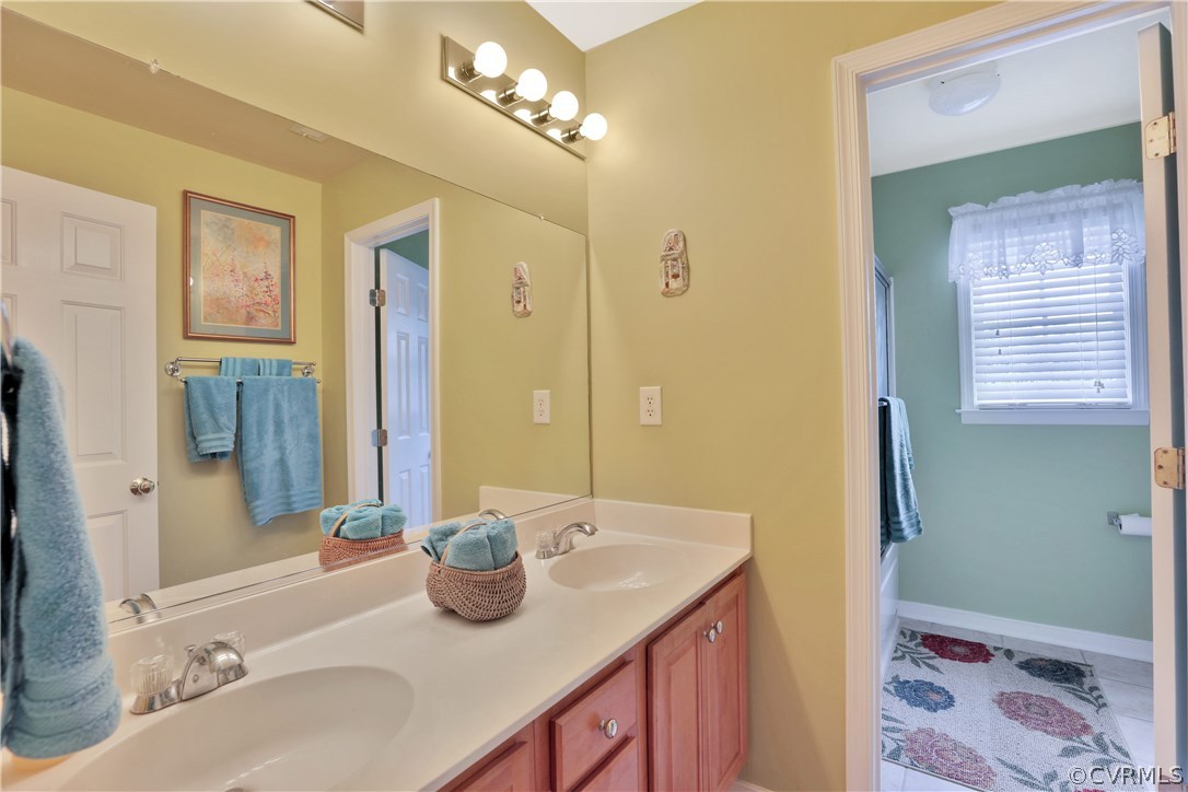 1201 Goswick Ridge Road Midlothian, VA 23114 - Photo 19 of 32 a bathroom with a granite countertop sink and a mirror