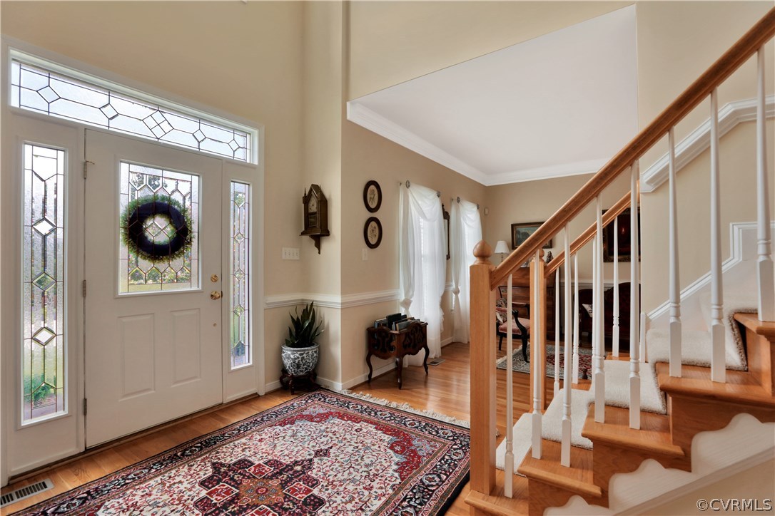1201 Goswick Ridge Road Midlothian, VA 23114 - Photo 2 of 32 a view of a hallway with wooden floor and windows