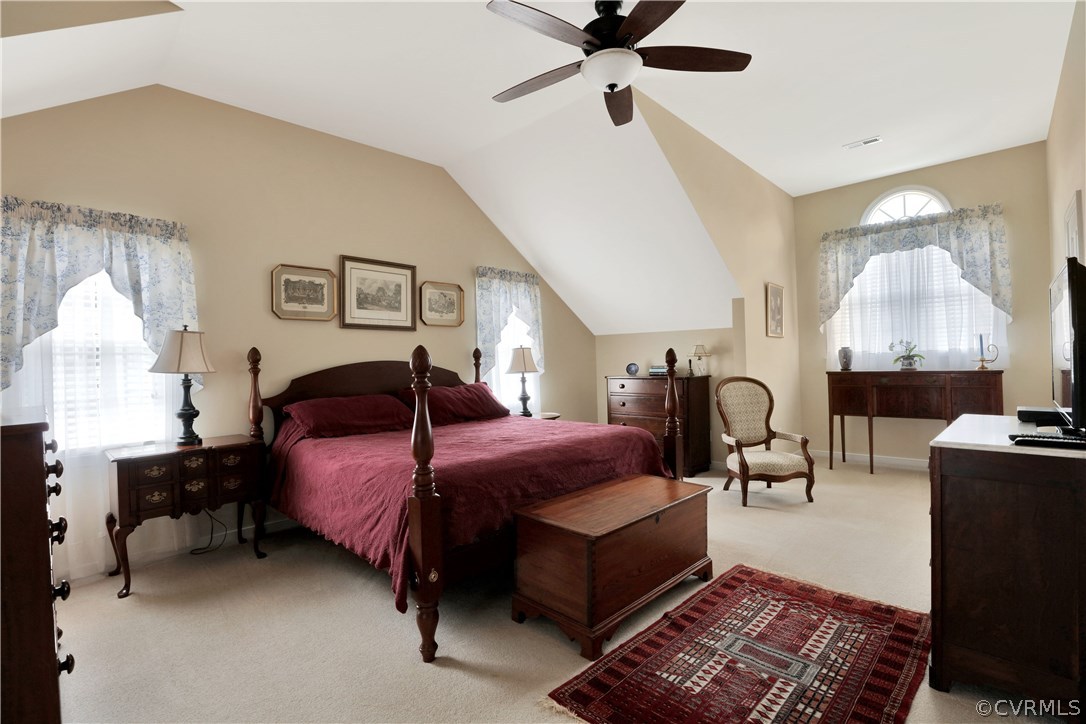 1201 Goswick Ridge Road Midlothian, VA 23114 - Photo 23 of 32 a bedroom with a bed a lamp on the table and a window