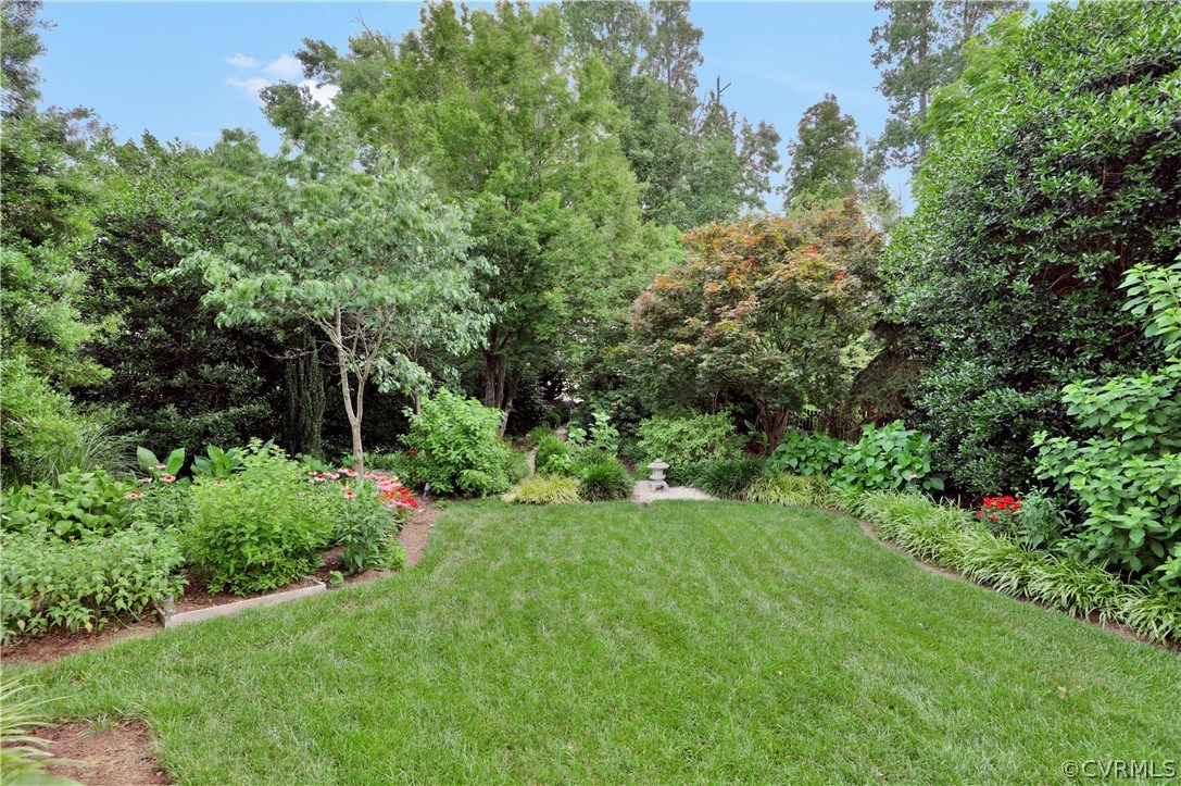 1201 Goswick Ridge Road Midlothian, VA 23114 - Photo 30 of 32 a view of a garden with large trees