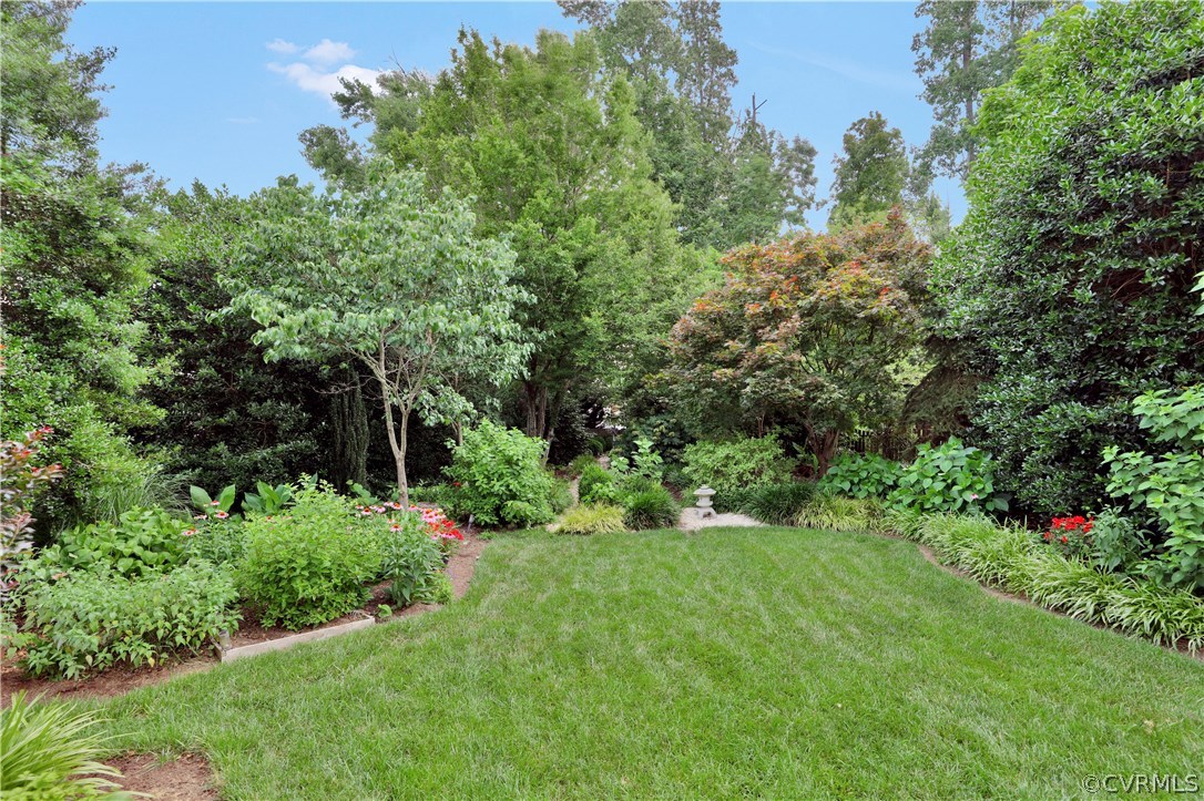 1201 Goswick Ridge Road Midlothian, VA 23114 - Photo 31 of 32 a view of a garden with plants and large trees