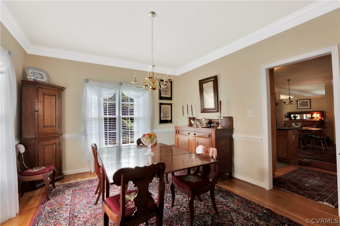 1201 Goswick Ridge Road Midlothian, VA 23114 - Photo 4 of 32 a view of a dining room with furniture window and wooden floor