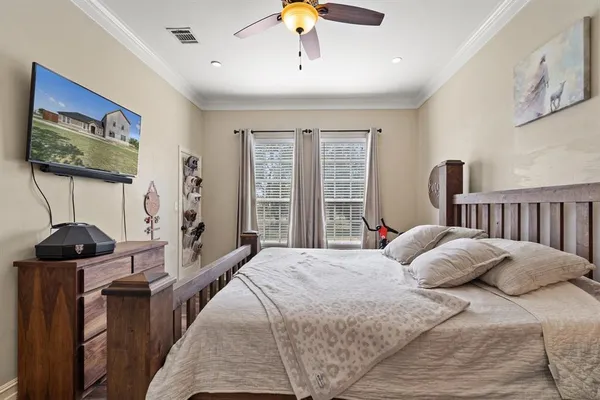 a bedroom with a bed and window