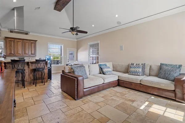 a living room with furniture and a dining table
