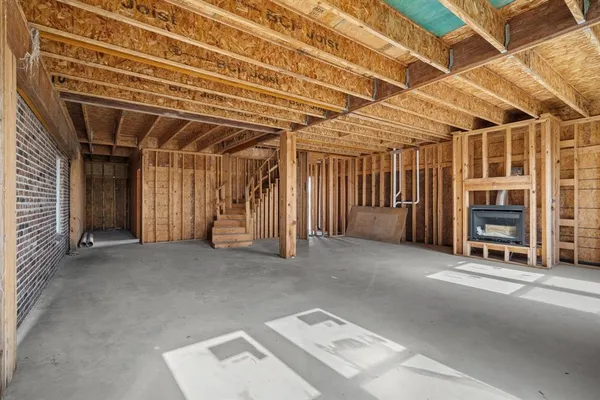 a view of an empty room with furniture