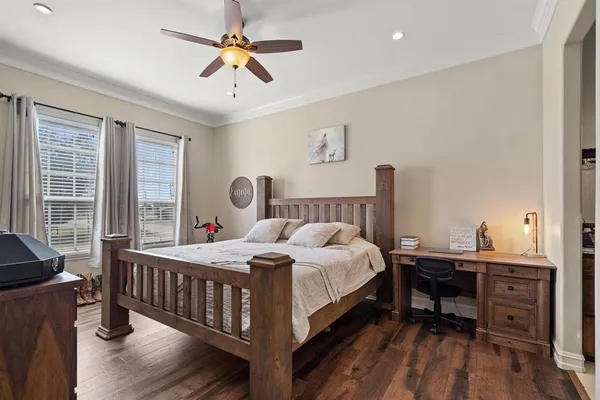 a bedroom with a bed and a table