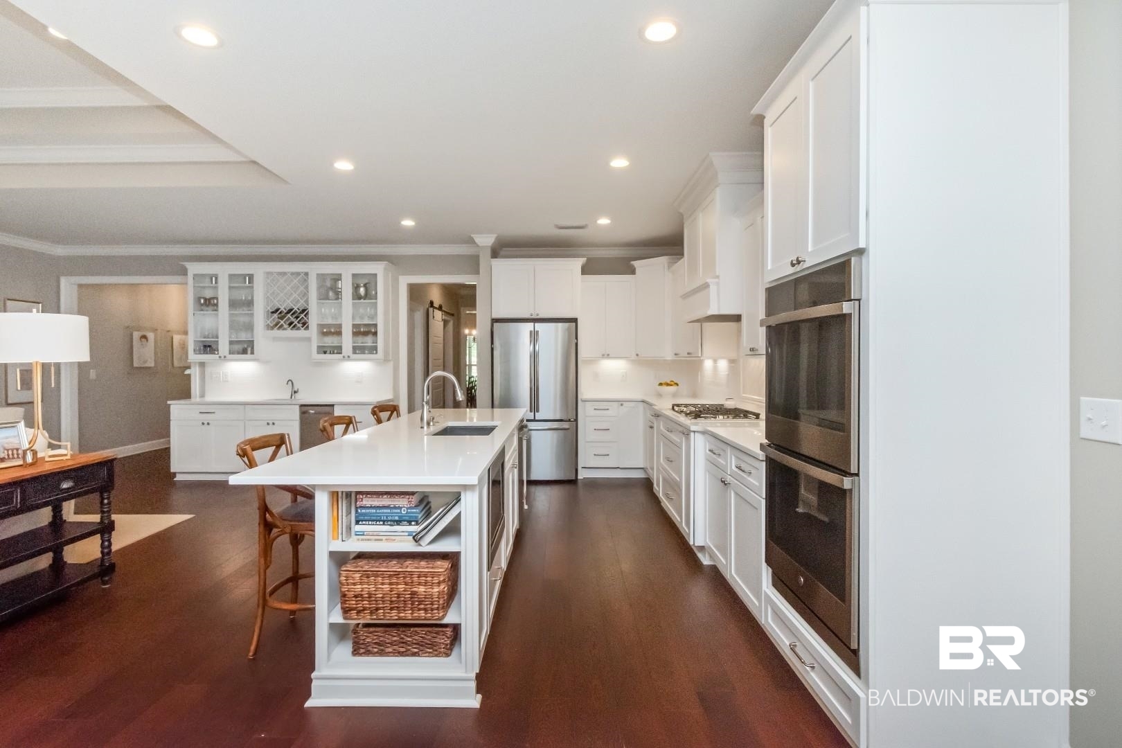 319 Springhill Woods Drive Mobile, AL 36608 - Photo 20 of 39 Kitchen featuring white cabinetry, appliances with stainless steel finishes, ornamental molding, a kitchen bar, and recessed lighting