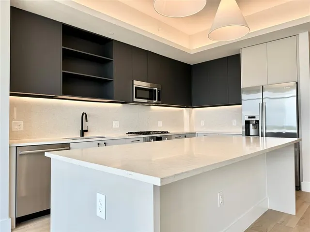a refrigerator freezer sitting inside of a kitchen