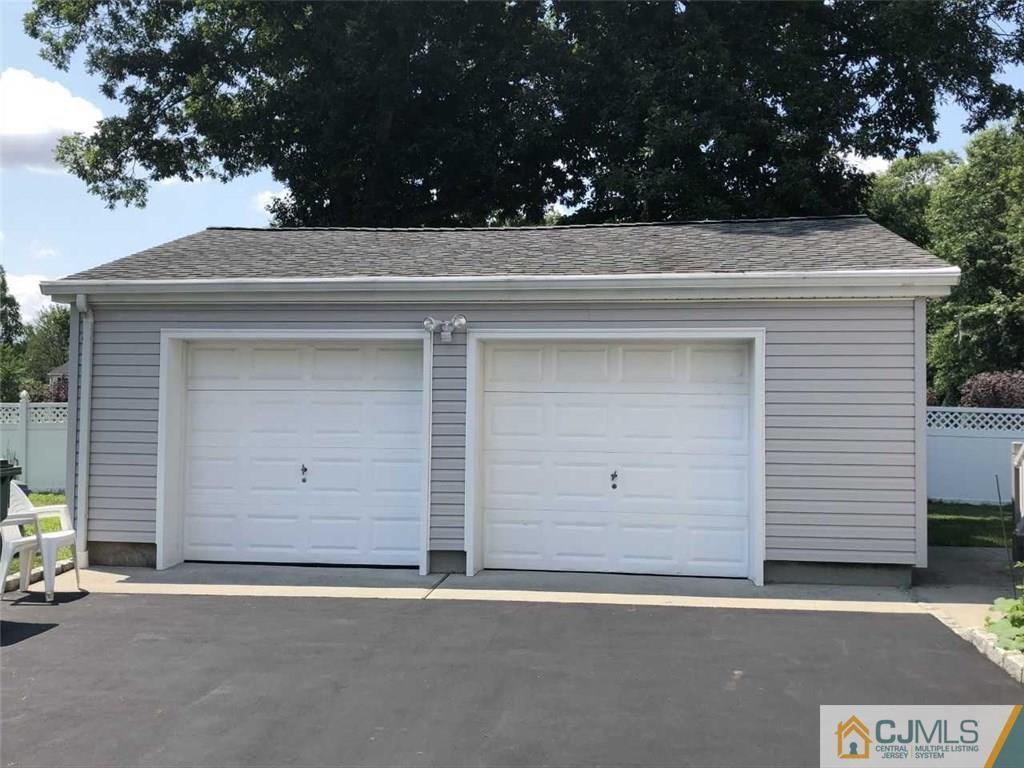36 Ferris Road Edison, NJ 08817 - Photo 22 of 22 a side view of a house with a garage